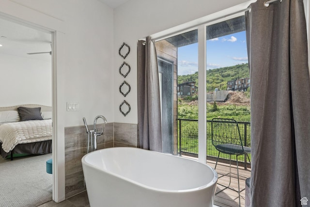 8210 N Toll Creek Ln, Park City, UT 84098 - ensuite bathroom with a soaking tub and tile patterned floors