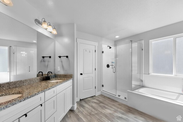 1608 W Gannett Dr, Saratoga Springs, UT 84045 - full bathroom with a stall shower, a garden tub, wood finished floors, double vanity, and healthy amount of natural light