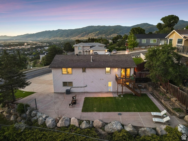 582 S Marialana Way E, North Salt Lake, UT 84054 - back of house featuring a patio, a deck with mountain view, and stairs