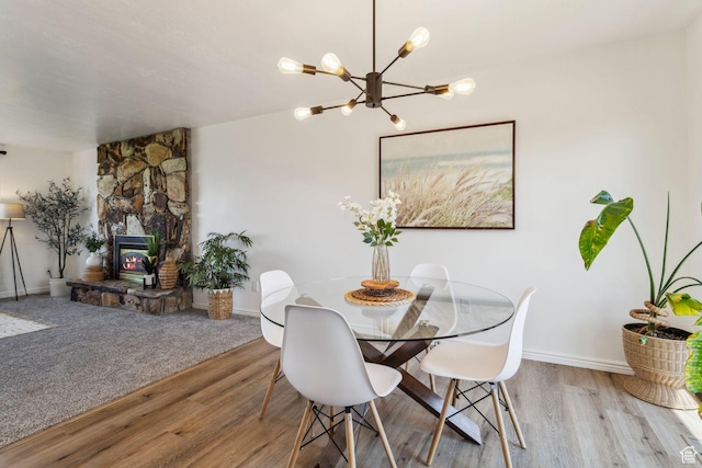 582 S Marialana Way E, North Salt Lake, UT 84054 - dining space with wood finished floors, a chandelier, and baseboards