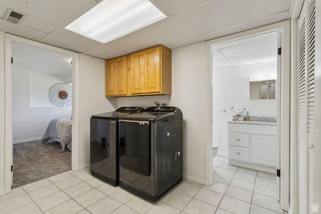 582 S Marialana Way E, North Salt Lake, UT 84054 - washroom with washer and dryer, light tile patterned floors, cabinet space, and baseboards