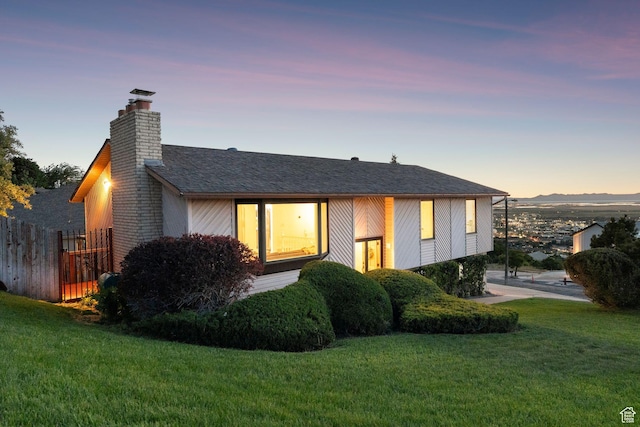 582 S Marialana Way E, North Salt Lake, UT 84054 - view of front of home featuring a chimney and a shingled roof