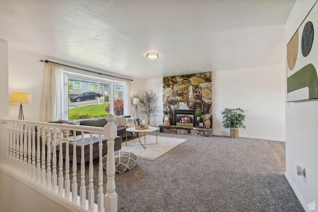 582 S Marialana Way E, North Salt Lake, UT 84054 - carpeted living area with baseboards and a stone fireplace