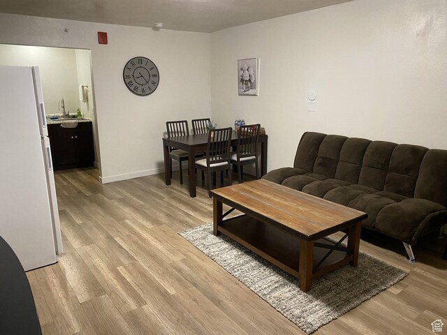 620 W Main St, Green River, UT 84525 - living room with light wood-style floors and baseboards