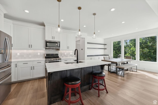786 S 820 E, Pleasant Grove, UT 84062 - kitchen with appliances with stainless steel finishes, a sink, tasteful backsplash, recessed lighting, and white cabinets