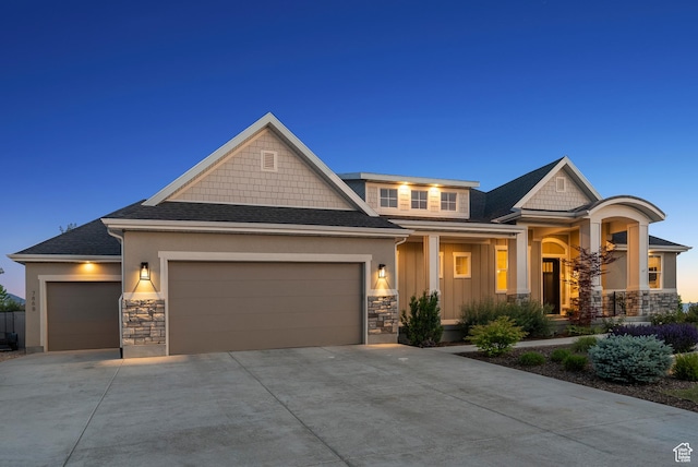 786 S 820 E, Pleasant Grove, UT 84062 - craftsman-style house featuring stone siding, an attached garage, concrete driveway, a shingled roof, and a porch