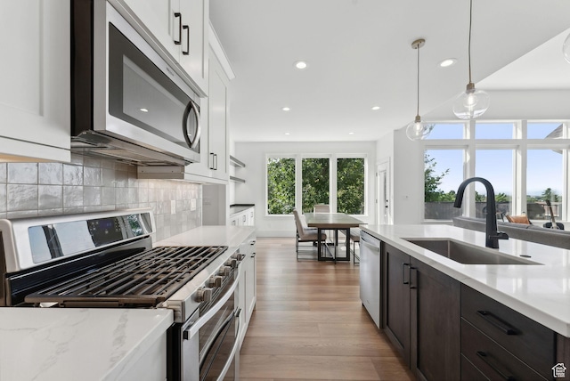 786 S 820 E, Pleasant Grove, UT 84062 - kitchen featuring stainless steel appliances, a sink, recessed lighting, light wood-type flooring, and white cabinets