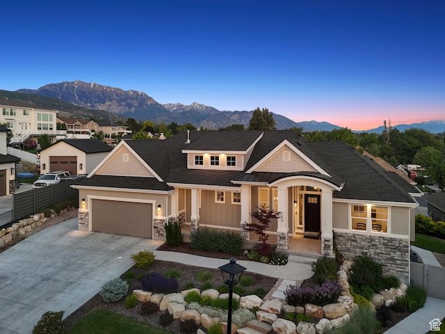 786 S 820 E, Pleasant Grove, UT 84062 - view of front facade with stone siding, a mountain view, and driveway