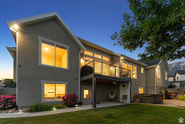 786 S 820 E, Pleasant Grove, UT 84062 - back of property featuring a hot tub, stucco siding, a patio, and a lawn
