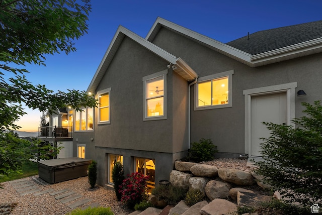 786 S 820 E, Pleasant Grove, UT 84062 - property exterior at dusk featuring stucco siding, a hot tub, and a balcony