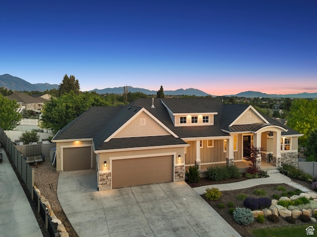 786 S 820 E, Pleasant Grove, UT 84062 - craftsman-style home with stone siding, an attached garage, a mountain view, and driveway