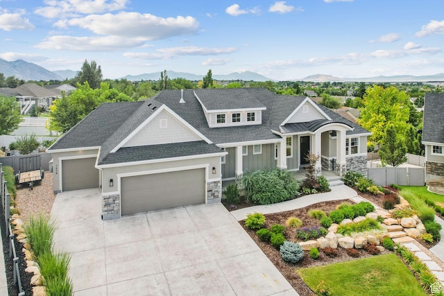 786 S 820 E, Pleasant Grove, UT 84062 - view of front of property with a garage, a mountain view, stone siding, and concrete driveway
