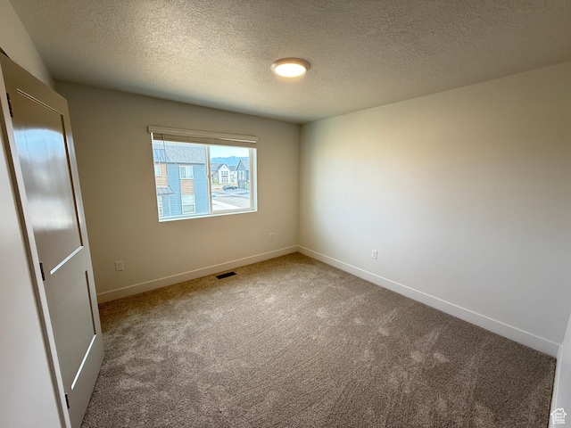 4582 W 3725 S Unit 241, West Haven, UT 84401 - empty room featuring carpet floors, baseboards, and a textured ceiling