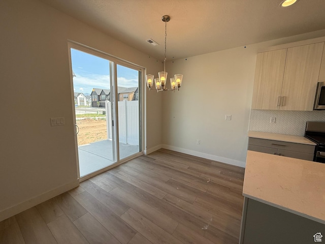 4582 W 3725 S Unit 241, West Haven, UT 84401 - unfurnished dining area with baseboards, a chandelier, wood finished floors, and recessed lighting