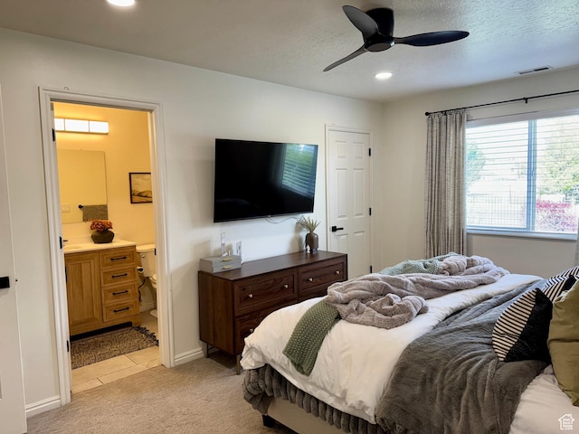 1720 N 2340 W, Lehi, UT 84043 - bedroom featuring light colored carpet, recessed lighting, ensuite bath, baseboards, and light tile patterned floors