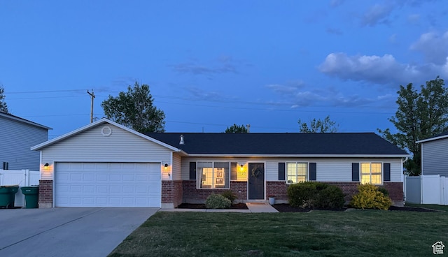 1720 N 2340 W, Lehi, UT 84043 - single story home with brick siding, driveway, and an attached garage