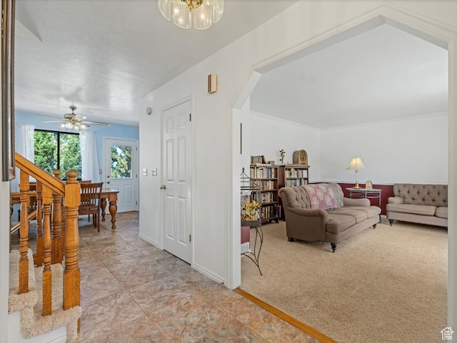 1735 Hayes Dr, Layton, UT 84040 - living room with arched walkways, a chandelier, a ceiling fan, light tile patterned floors, and light carpet