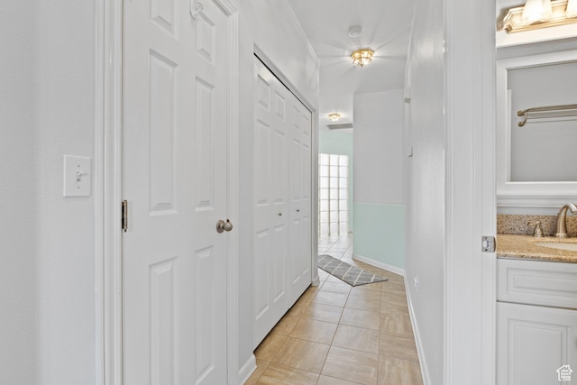 1186 E 900 S Unit 20, St George, UT 84790 - corridor featuring a sink, light tile patterned floors, and baseboards