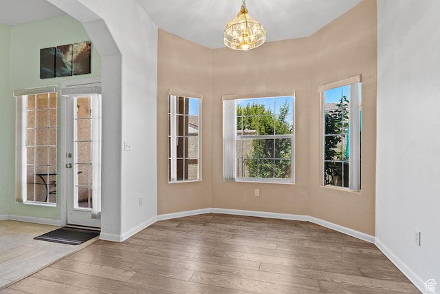 1186 E 900 S Unit 20, St George, UT 84790 - entryway with a chandelier, wood-type flooring, baseboards, and arched walkways