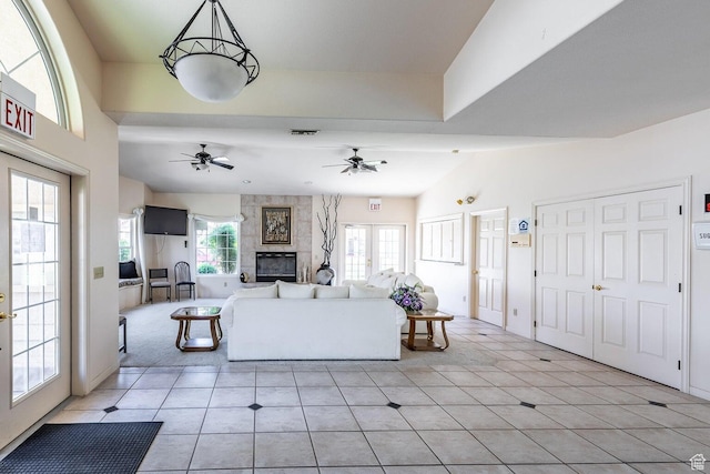 1186 E 900 S Unit 20, St George, UT 84790 - living room with a tile fireplace, a ceiling fan, and light tile patterned flooring