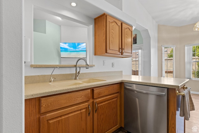 1186 E 900 S Unit 20, St George, UT 84790 - kitchen with dishwasher, a sink, light wood-style flooring, and brown cabinets