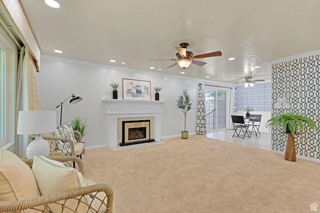 895 E 1015 S, Ogden, UT 84404 - carpeted living area featuring recessed lighting, a ceiling fan, crown molding, baseboards, and a fireplace with flush hearth