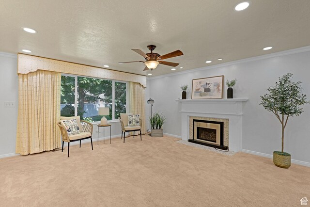 895 E 1015 S, Ogden, UT 84404 - sitting room with recessed lighting, carpet flooring, a fireplace with flush hearth, crown molding, and a ceiling fan