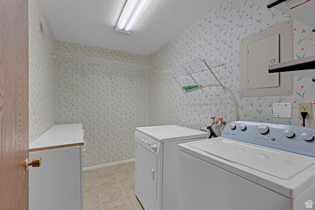 895 E 1015 S, Ogden, UT 84404 - laundry room featuring washer and dryer, wallpapered walls, light tile patterned flooring, baseboards, and a textured ceiling
