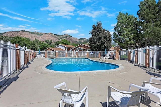 895 E 1015 S, Ogden, UT 84404 - community pool with a mountain view and a patio area