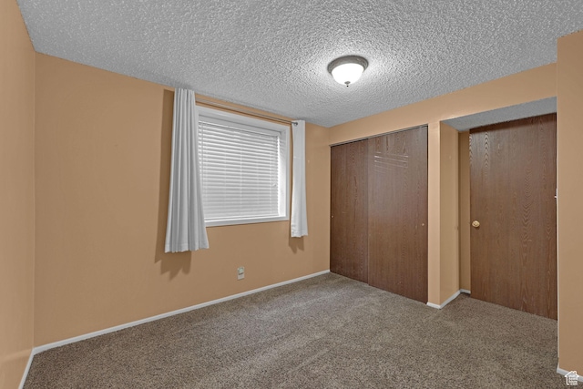 895 E 1015 S, Ogden, UT 84404 - unfurnished bedroom featuring carpet, a textured ceiling, a closet, and baseboards