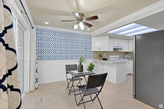 895 E 1015 S, Ogden, UT 84404 - dining area featuring a ceiling fan, crown molding, and light tile patterned flooring