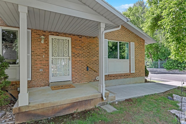 895 E 1015 S, Ogden, UT 84404 - view of exterior entry featuring brick siding and a porch