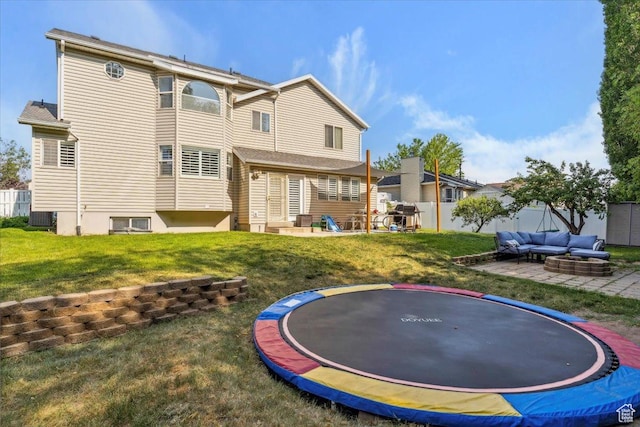 1171 N 900 W, Clinton, UT 84015 - back of property featuring a trampoline, outdoor lounge area, a patio area, and cooling unit