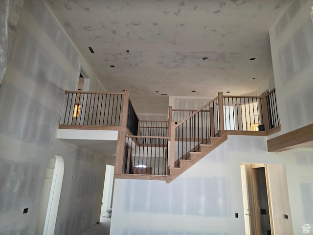 1419 E Heights Way S Unit 15, Fruit Heights, UT 84037 - staircase with a high ceiling and arched walkways