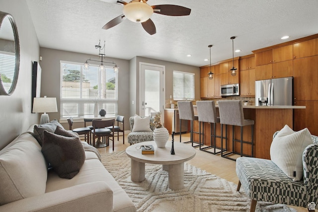 333 E Stanton Ave S, Salt Lake City, UT 84111 - living area with a textured ceiling, ceiling fan, light wood-type flooring, and recessed lighting