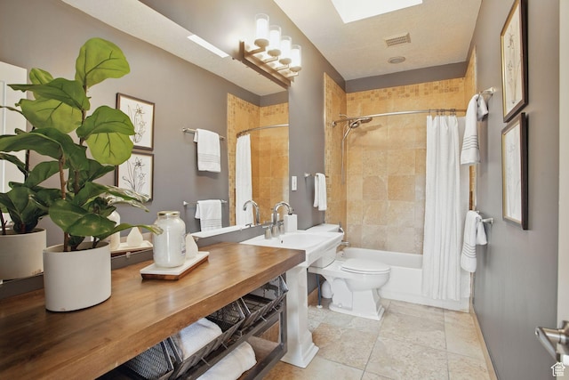 333 E Stanton Ave S, Salt Lake City, UT 84111 - bathroom with shower / bathtub combination with curtain, baseboards, toilet, and a sink