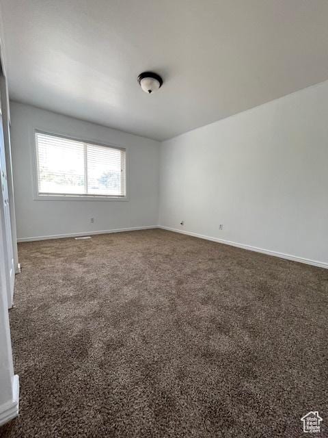 3780 S 7200 W, Magna, UT 84044 - carpeted empty room featuring baseboards