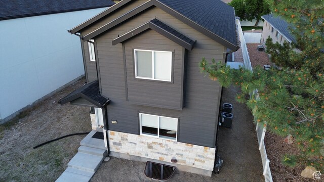105 S 600 E, Provo, UT 84606 - view of property exterior featuring stone siding and central AC unit