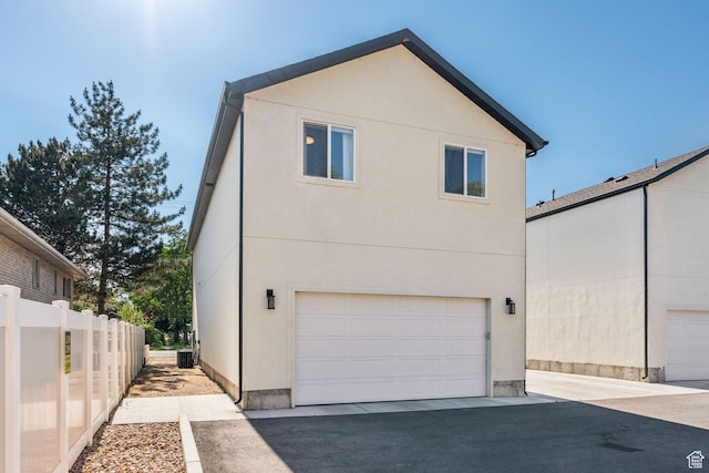 105 S 600 E, Provo, UT 84606 - view of side of property featuring stucco siding and a garage