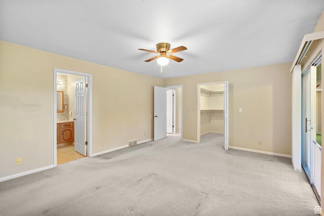 2718 E 200 N, Layton, UT 84040 - unfurnished bedroom with light carpet, baseboards, a spacious closet, a closet, and ensuite bath