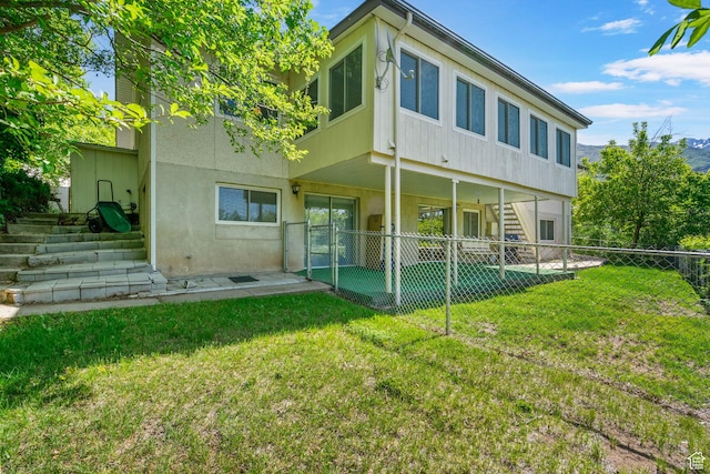 2718 E 200 N, Layton, UT 84040 - rear view of property featuring a patio, stairway, and stucco siding