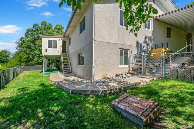 2718 E 200 N, Layton, UT 84040 - rear view of property featuring stucco siding, stairway, and a gate