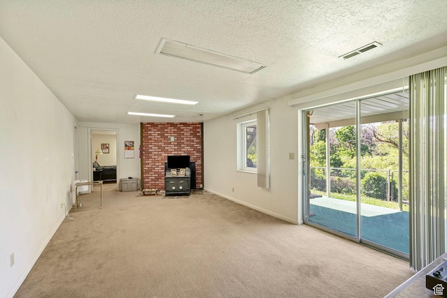 2718 E 200 N, Layton, UT 84040 - unfurnished living room featuring attic access, a textured ceiling, carpet floors, and baseboards