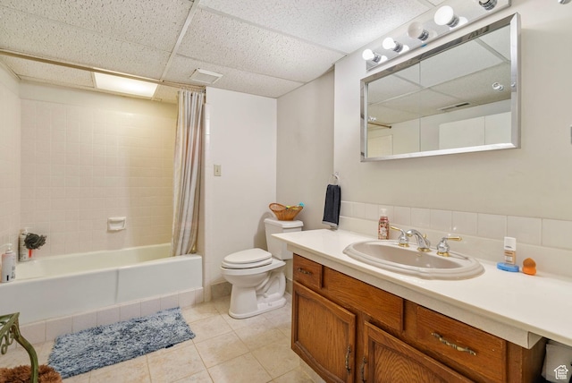 2718 E 200 N, Layton, UT 84040 - bathroom featuring toilet, vanity, tile patterned floors, shower / tub combo with curtain, and a paneled ceiling