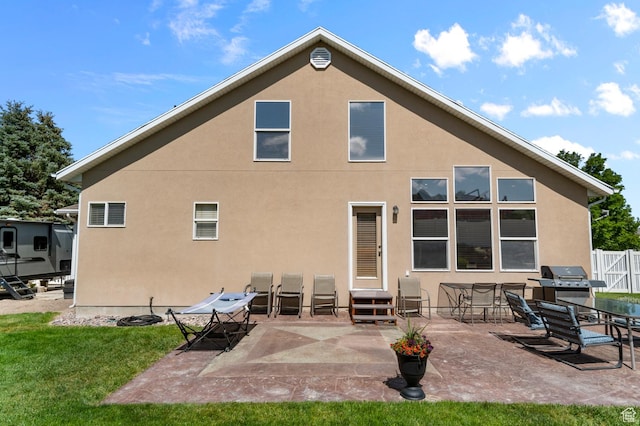 14008 S Emmeline Dr, Herriman, UT 84096 - rear view of house featuring stucco siding, a patio area, and entry steps
