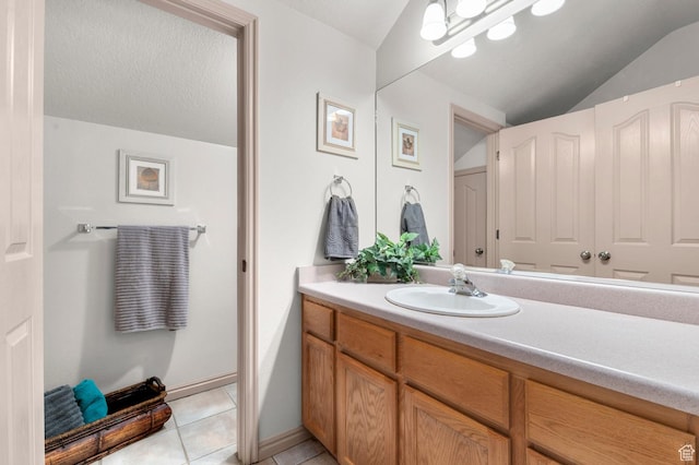 14008 S Emmeline Dr, Herriman, UT 84096 - bathroom with vaulted ceiling, vanity, and tile patterned floors