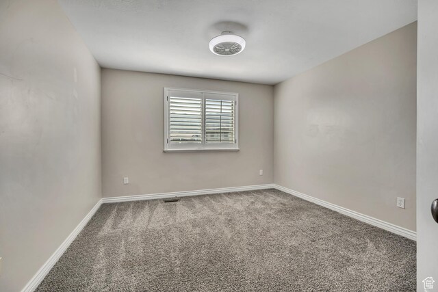 5258 N Ponderosa Ln, Stansbury Park, UT 84074 - carpeted empty room featuring baseboards