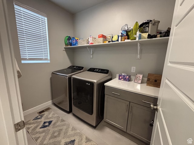 11603 S Outfitter Way S, Jordan, UT 84009 - laundry room featuring separate washer and dryer, light tile patterned floors, cabinet space, and baseboards