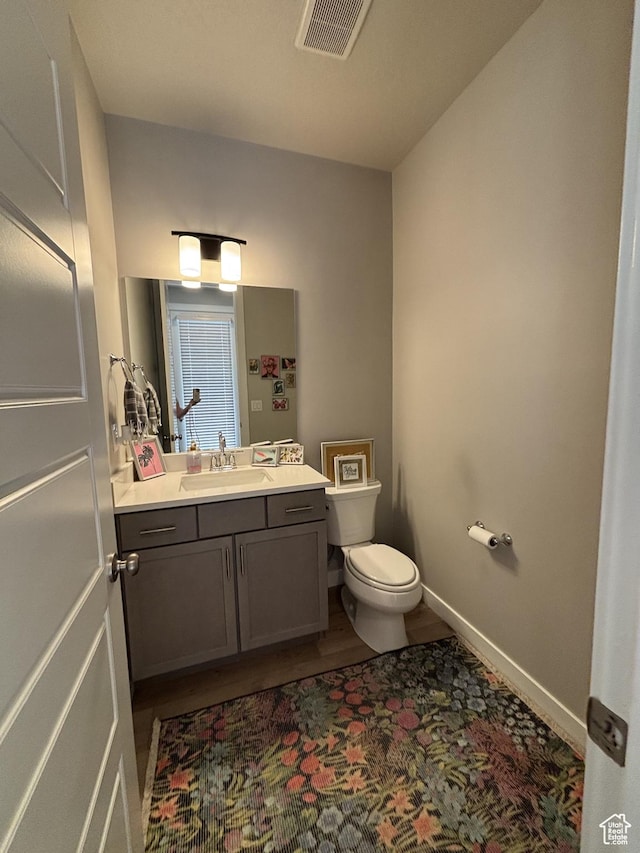 11603 S Outfitter Way S, Jordan, UT 84009 - half bathroom with vanity, toilet, wood finished floors, and baseboards