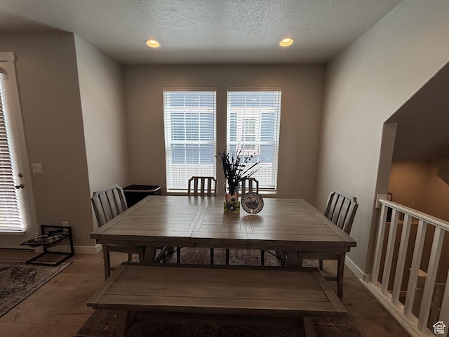 11603 S Outfitter Way S, Jordan, UT 84009 - dining area featuring wood finished floors, recessed lighting, baseboards, and a textured ceiling